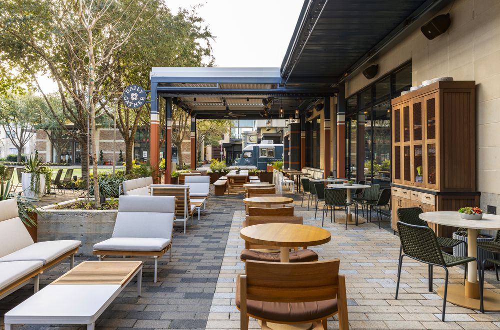 Daily Gather’s patio, which is outfitted with a variety of seating and tables.