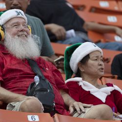 Hawaii fans dressed up in their Christmas gear wait for the start of the Hawaii Bowl NCAA college football game between BYU and Hawaii, Tuesday, Dec. 24, 2019, in Honolulu.