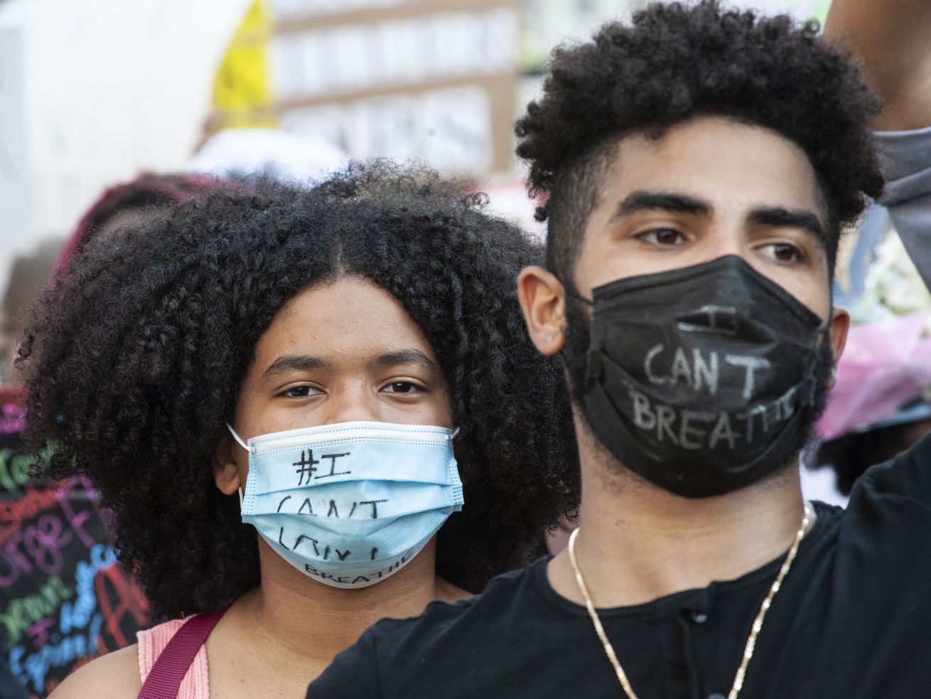 Protesters in New York on May 29 wear face masks that read “I can’t breathe.”