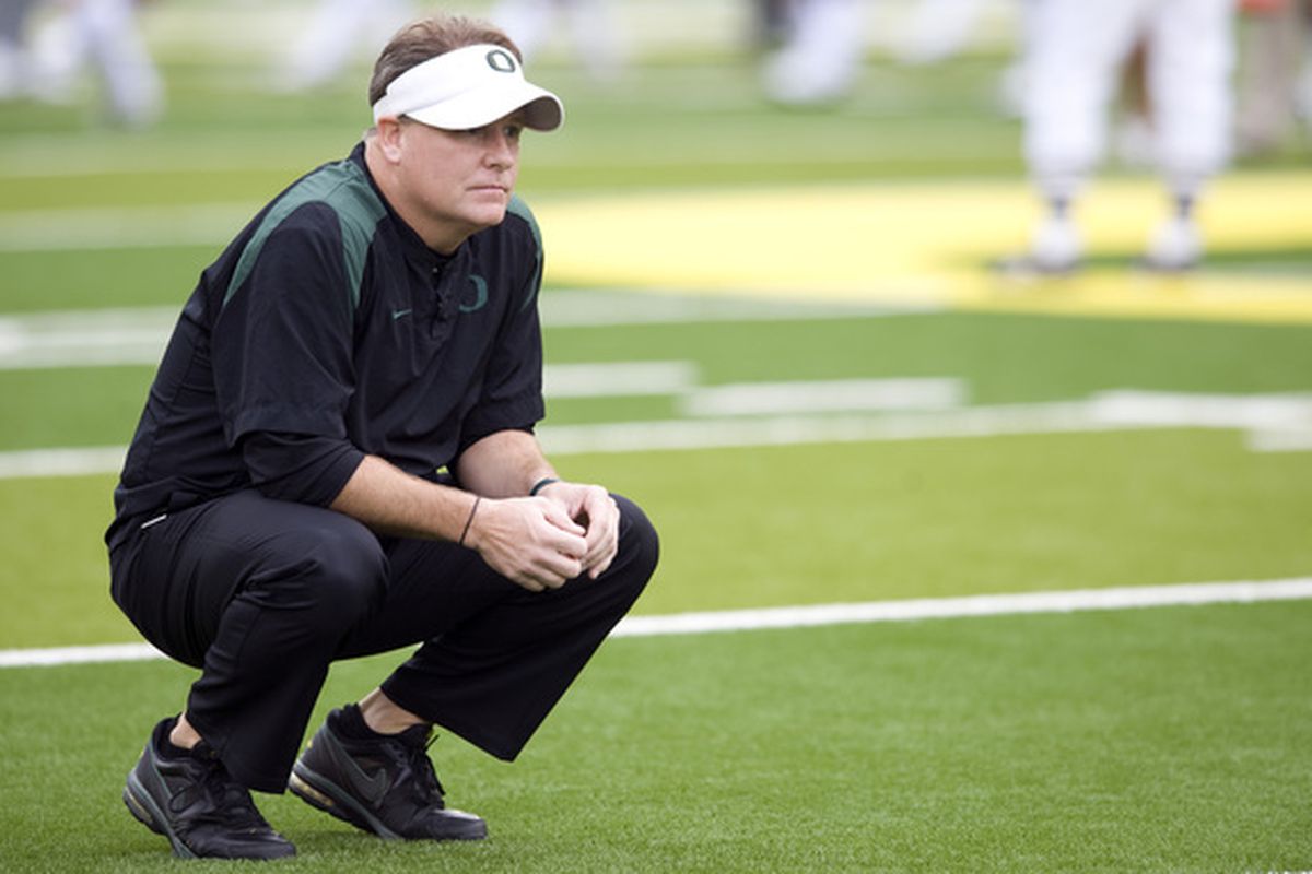 EUGENE OR - NOVEMBER 6: Head coach Chip Kelly of the Oregon Ducks watches his team warm up before the game against the Washington Huskies at Autzen Stadium on November 6 2010 in Eugene Oregon. (Photo by Steve Dykes/Getty Images)