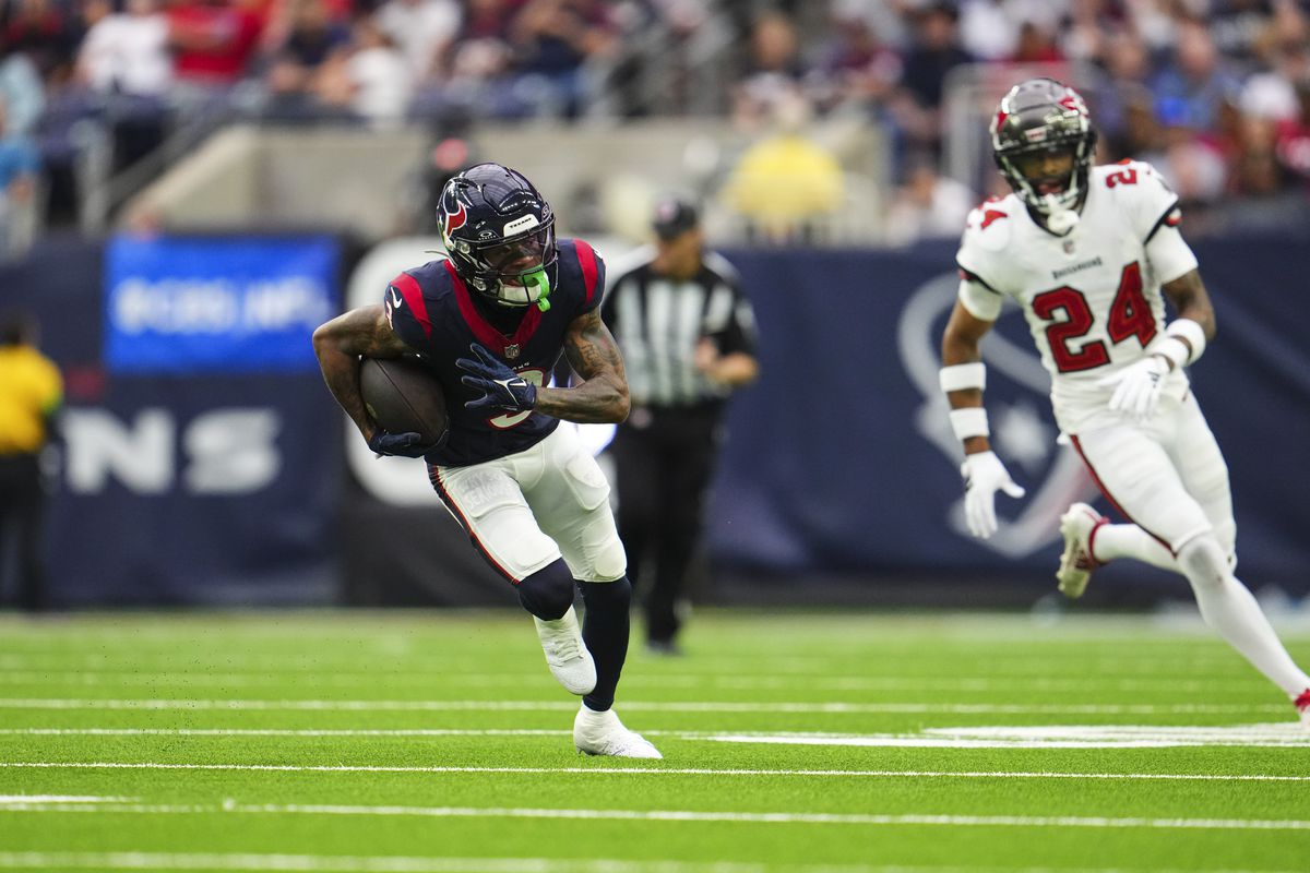 Tank Dell of the Houston Texans runs the ball during an NFL football game against the Tampa Bay Buccaneers at NRG Stadium on November 5, 2023 in Houston, Texas.