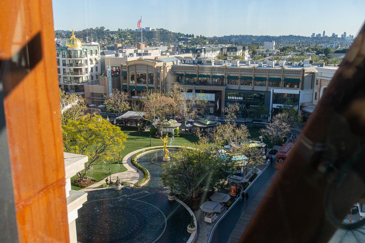 A shot from the parking garage elevator of the Americana looks over a sprawling lawn and fountain. 