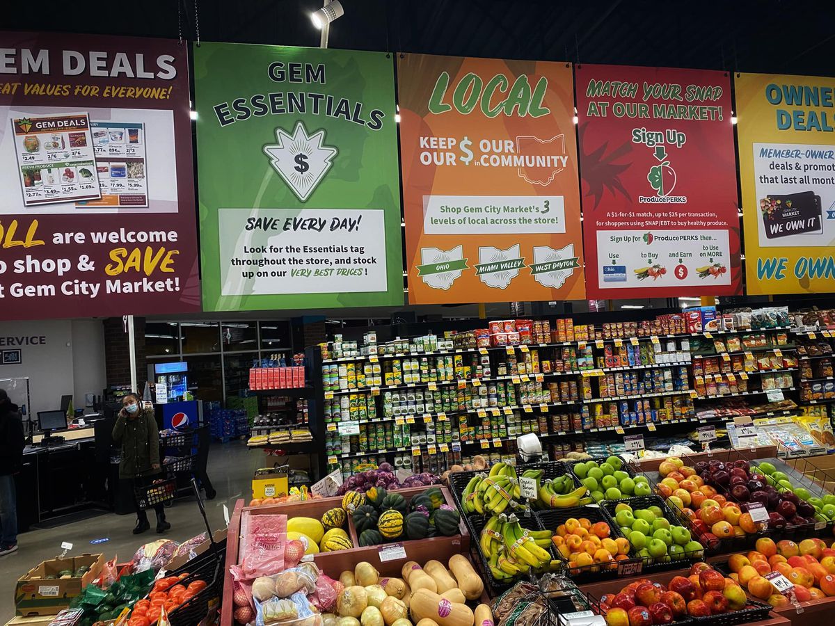 Signage in a produce section in a grocery.