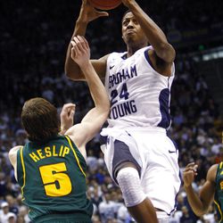 BYU's #24 Damarcus Harrison flies in for a shot over Baylor's #5 Brady Heslip as BYU and Baylor play Saturday, Dec. 17, 2011 in the Marriott Center in Provo. Baylor won 86-83.