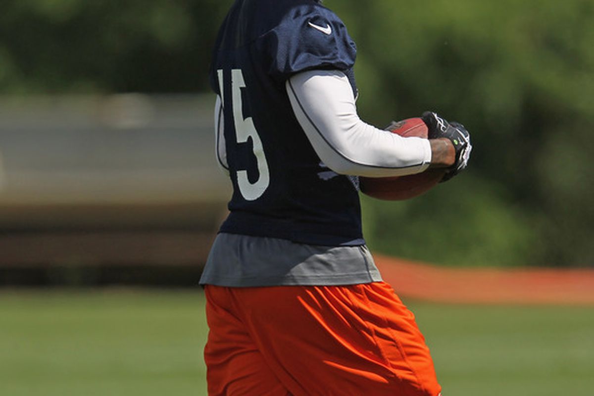 LAKE FOREST, IL - JUNE 12:  Brandon Marshall #15 of the Chicago Bears looks back at defenders after catching a pass during a minicamp practice at Halas Hall on June 12, 2012 in Lake Forest, Illinois.  (Photo by Jonathan Daniel/Getty Images)