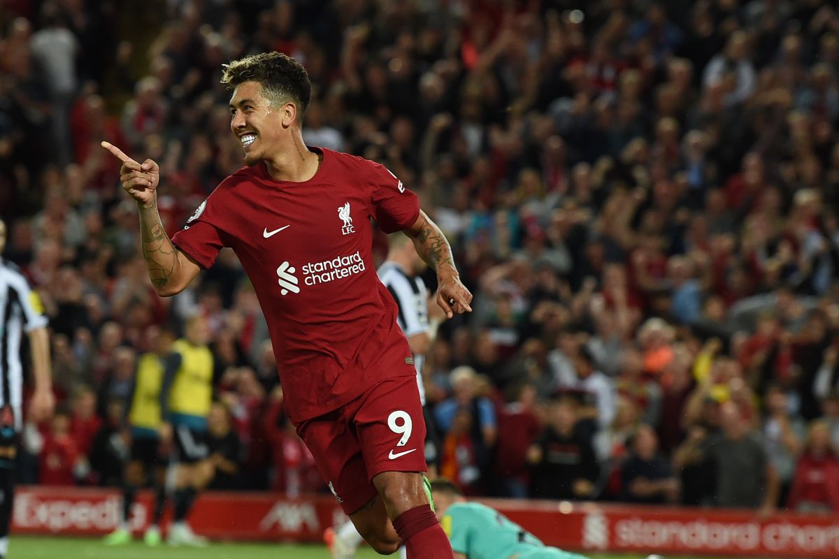 Roberto Firmino of Liverpool celebrates after scoring the first goal during the Premier League match between Liverpool FC and Newcastle United at Anfield on August 31, 2022 in Liverpool, England.