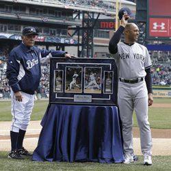 New York Yankees relief pitcher Mariano Rivera acknowledges the crowd with Detroit Tigers manager Jim Leyland after being presented a frame with photographs of him pitching at Tiger Stadium and Comerica Park before a baseball game in Detroit, Sunday, April 7, 2013. 