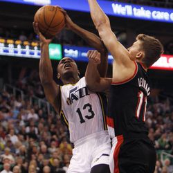 Utah Jazz guard Elijah Millsap (13) draws some contact while going to the basket against Portland Friday, Feb. 20, 2015, at EnergySolutions Arena in Salt Lake City. The Jazz beat the Blazers, 92-76.