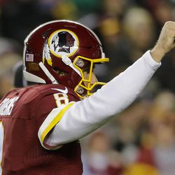 Washington Redskins quarterback Kirk Cousins (8) celebrates running back Rob Kelley's touchdown during the first half of an NFL football game against the Green Bay Packers in Landover, Md., Sunday, Nov. 20, 2016. 