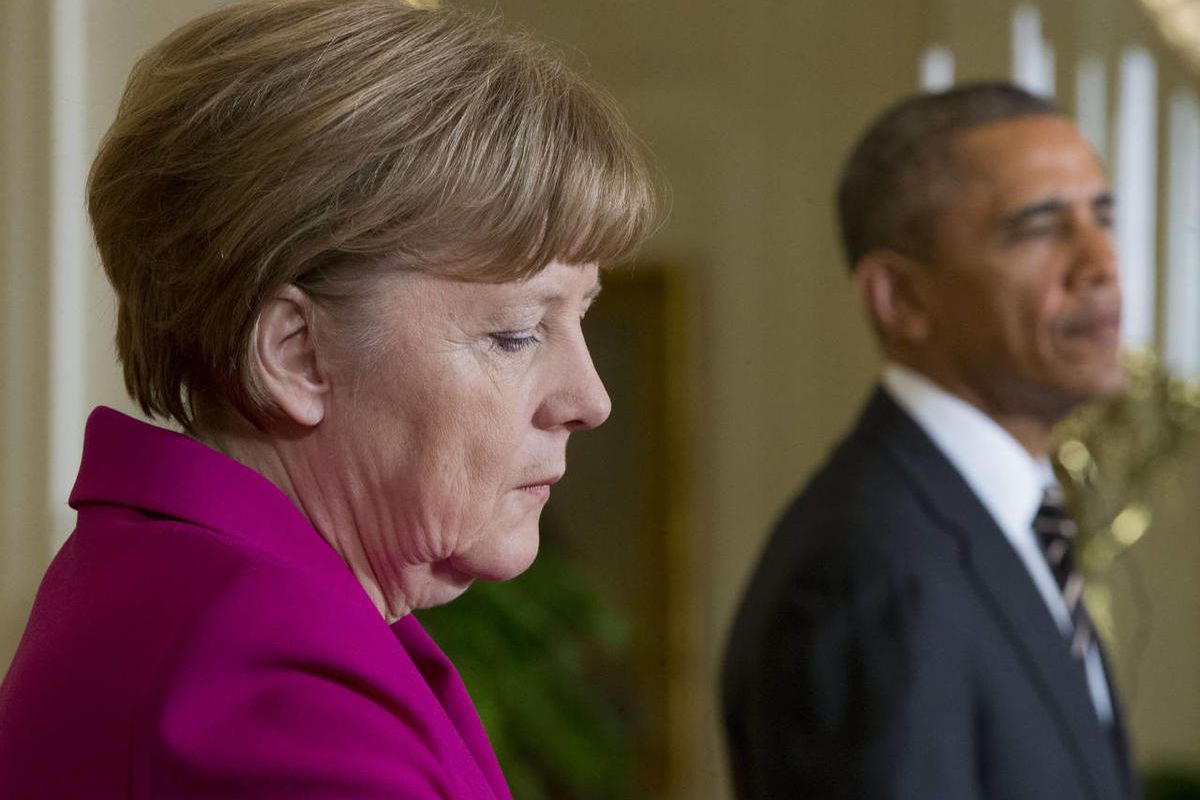 German Chancellor Angela Merkel, left, and President Barack Obama, right, during their joint news conference in the East Room of the White House in Washington,  Monday, Feb. 9, 2015. The leaders were expected to discuss the ongoing conflict in Ukraine, an