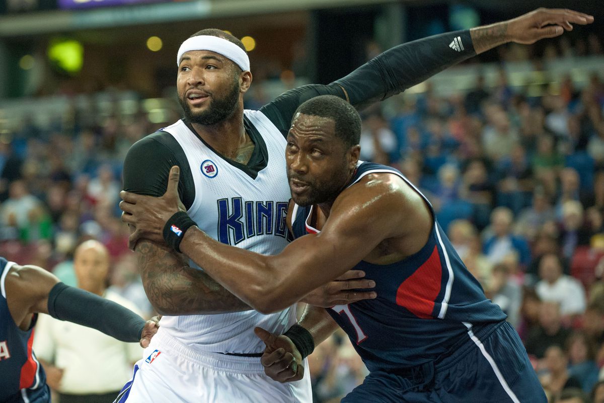 Elton Brand jostles in the paint with DeMarcus Cousins