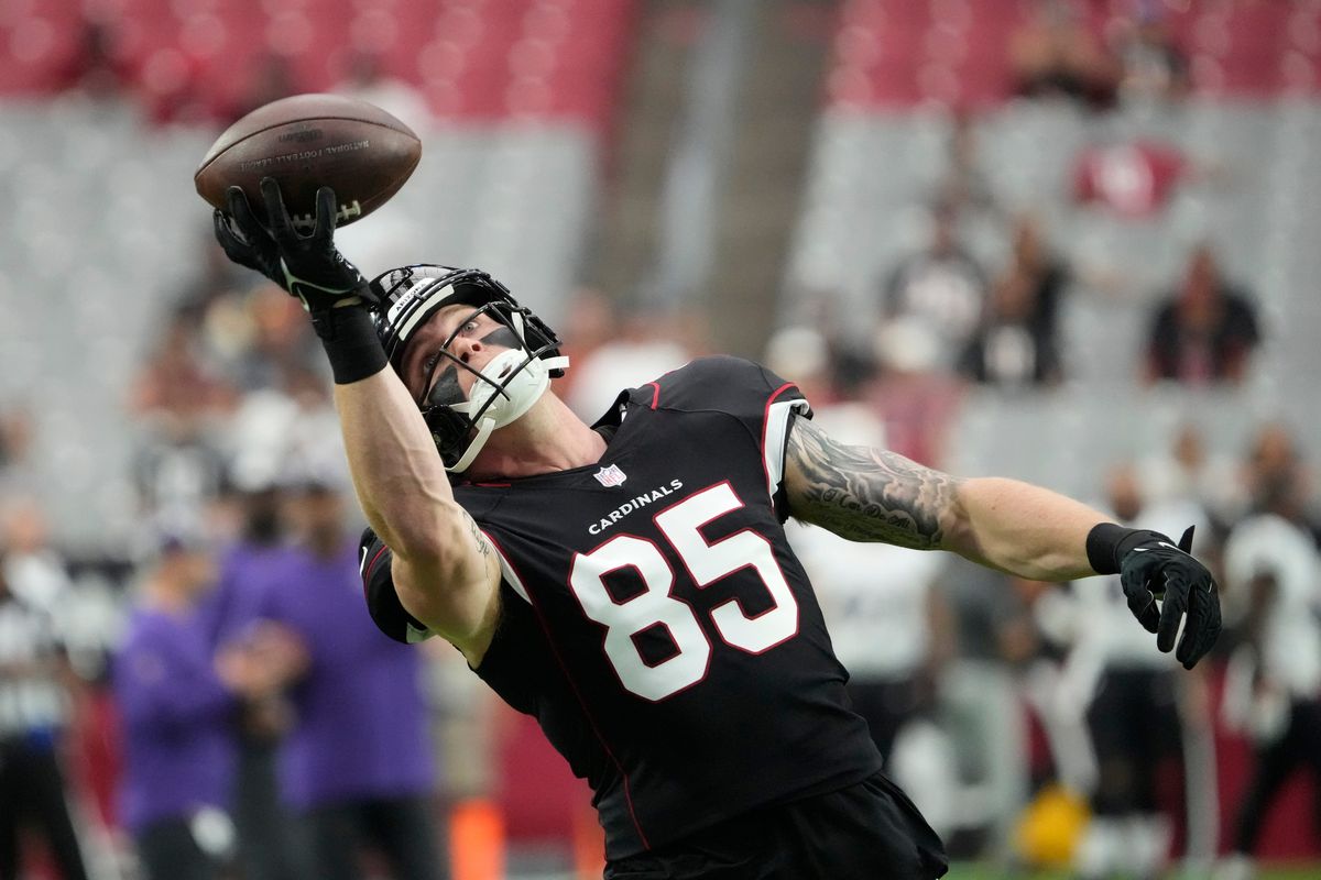 Arizona Cardinals tight end Trey McBride warms up before playing against the Baltimore Ravens in a preseason game at State Farm Stadium.