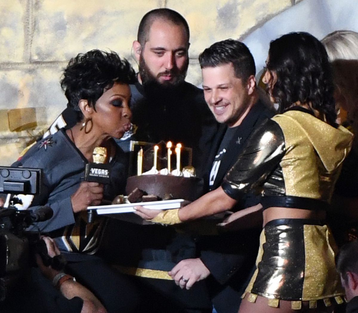 Gladys Knight blows out candles on a birthday cake after performing ‘God Bless America’ between periods of Game 1 of the Stanley Cup Finals.