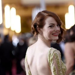 Emma Stone arrives at the Oscars on Sunday, Feb. 22, 2015, at the Dolby Theatre in Los Angeles. 