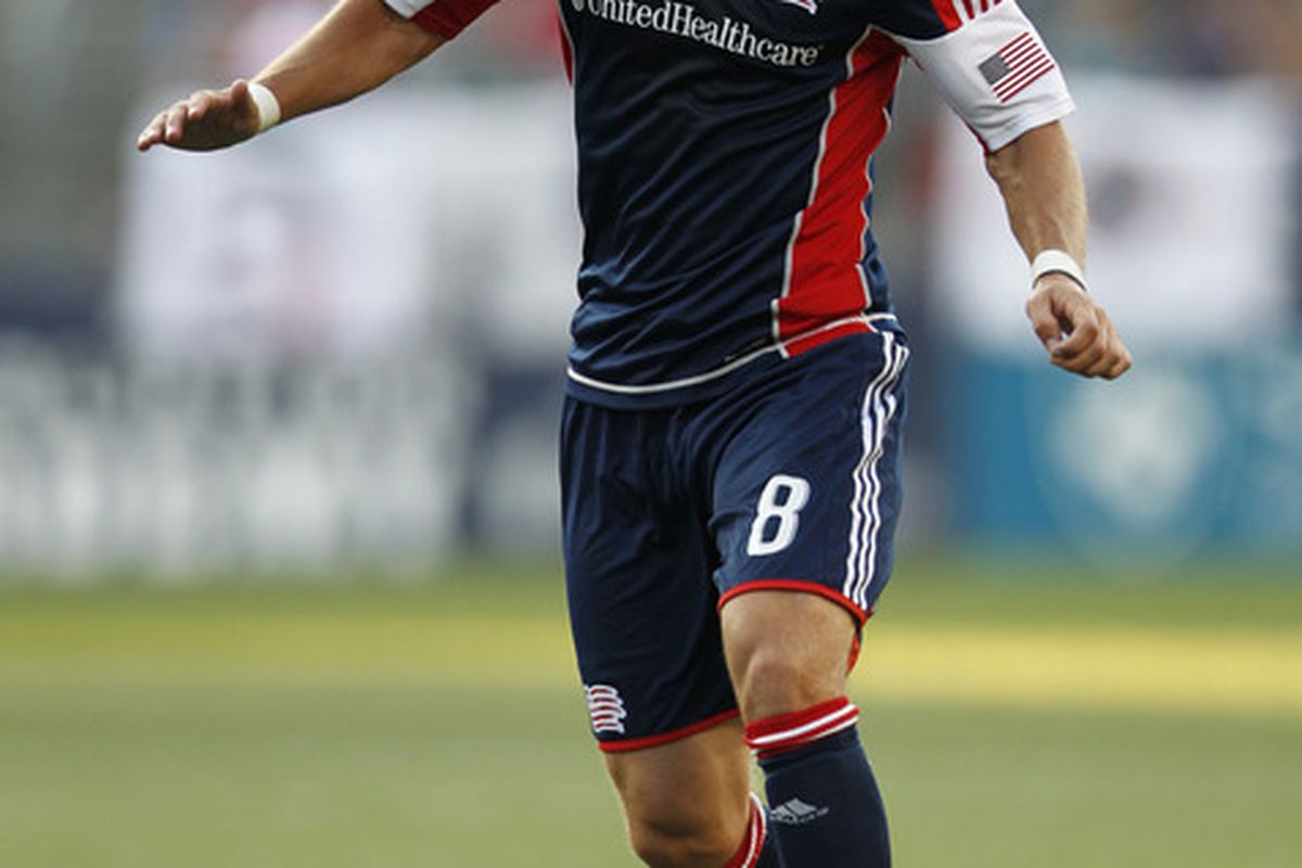 July 8, 2012; Foxboro, Massachusetts, USA; New England Revolution defenseman Chris Tierney (8) controls the ball during the first half against the New York Red Bulls at Gillette Stadium.  Mandatory Credit: Greg M. Cooper-US PRESSWIRE