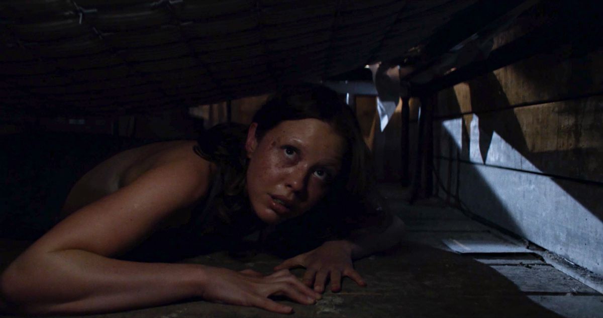 In X by Ti West, Mia Goth is hiding under the floor.
