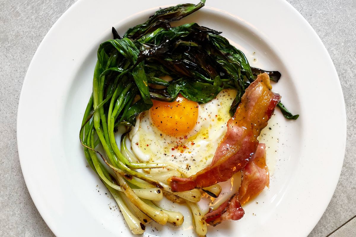 A dish of grill ramps served with pancetta and eggs