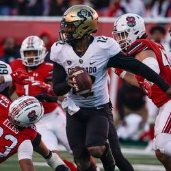 Colorado quarterback Brendon Lewis (12) runs with the ball against Utah in an NCAA football game at Rice-Eccles Stadium in Salt Lake City on Friday, Nov. 26, 2021.