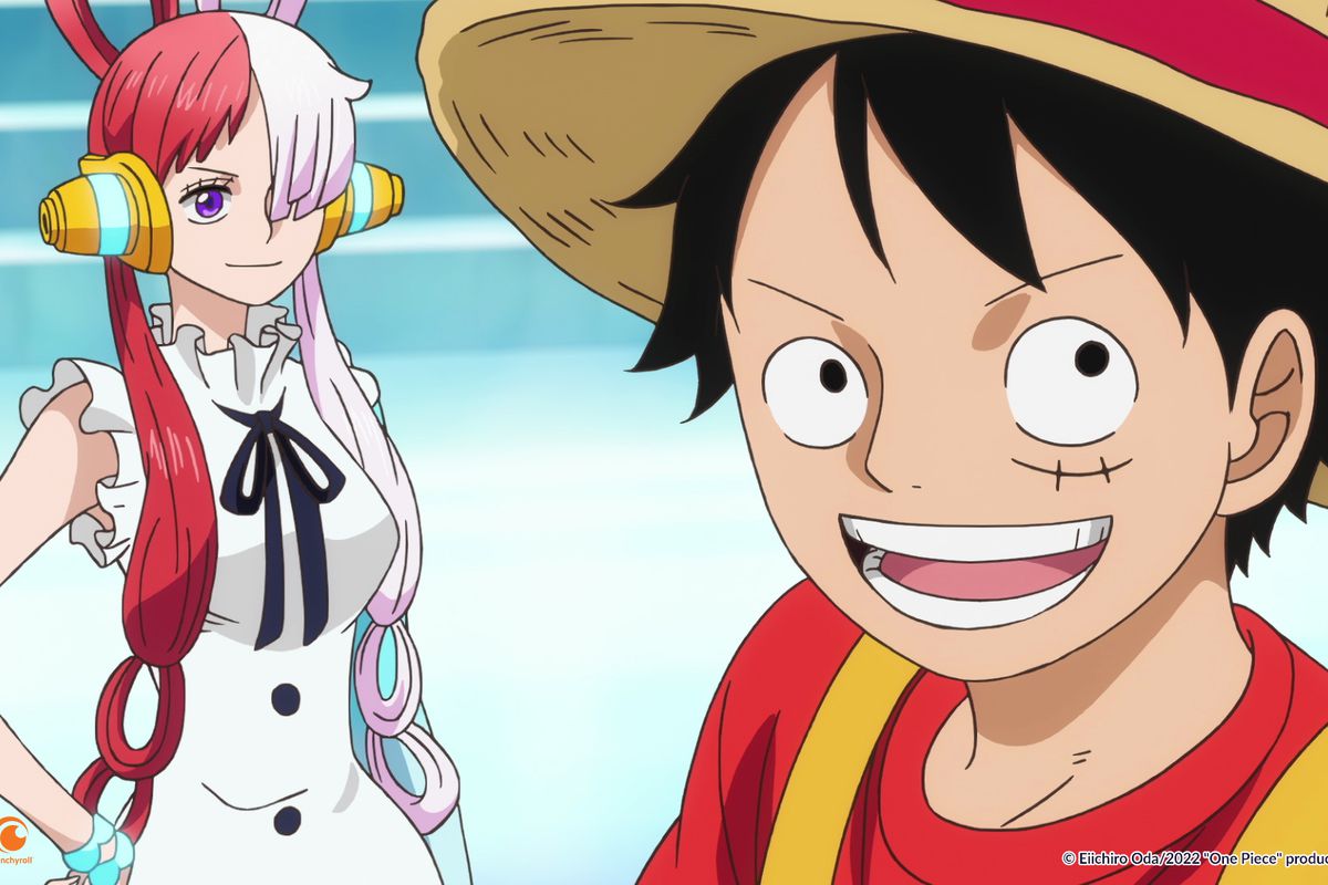 luffy, a dark haired man with a straw hat, standing next to a pretty girl with red hair 