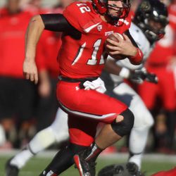 Utah quarterback Adam Schulz (12) runs with the ball during the second half of a football game against Colorado at the Rice-Eccles Stadium in Salt Lake City on Saturday, Nov. 30, 2013. Utah won 24-17.