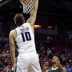 Utah State Aggies forward Quinn Taylor dunks the ball against the Colorado State Rams during the Mountain West Conference basketball tournament in Las Vegas on Wednesday, March 7, 2018.