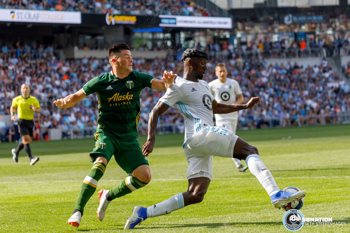 August 4, 2019 - Saint Paul, Minnesota, United States - Portland Timbers defender Jorge Moreira (2) is beat by Minnesota United defender Ike Opara (3) during the match at Allianz Field. 
