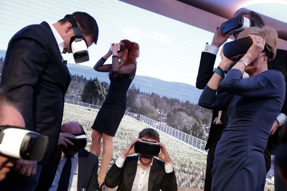 People in business attire in an outdoor setting, all wearing virtual reality headsets.