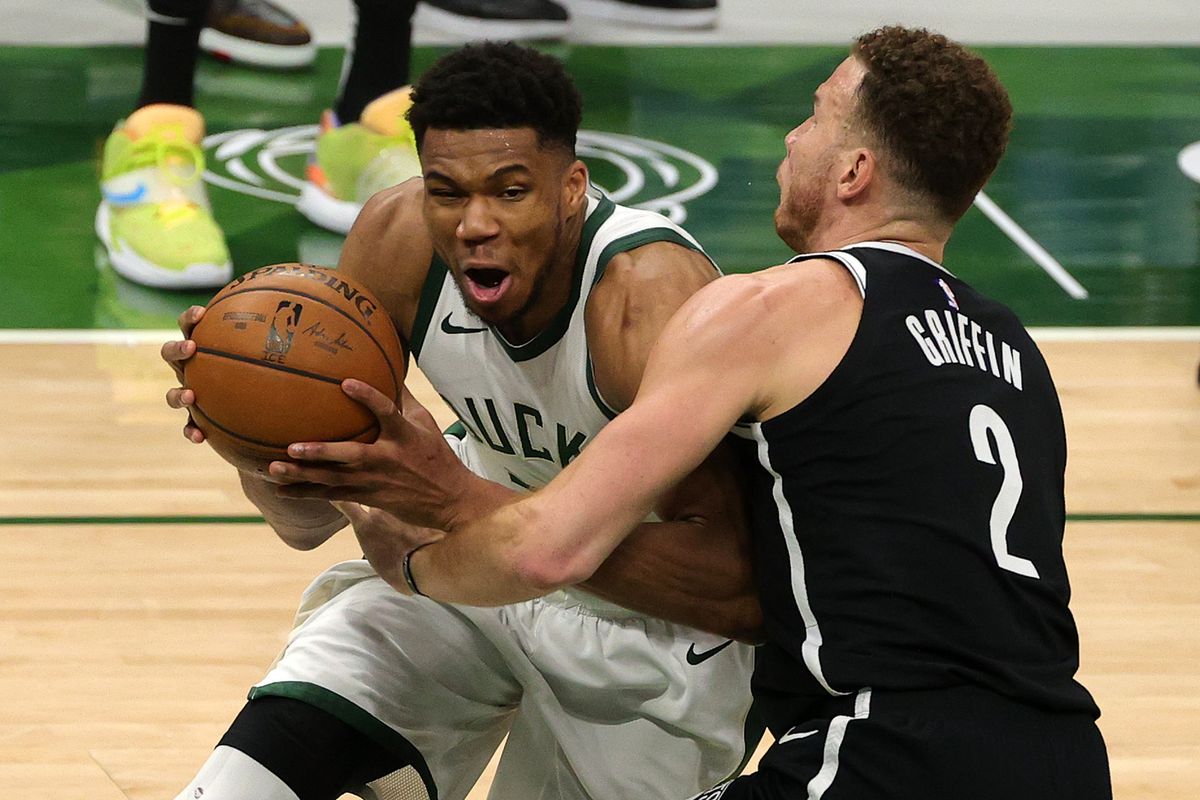 Giannis Antetokounmpo of the Milwaukee Bucks is defended by Blake Griffin of the Brooklyn Nets during the second half of a game at Fiserv Forum on May 04, 2021 in Milwaukee, Wisconsin.