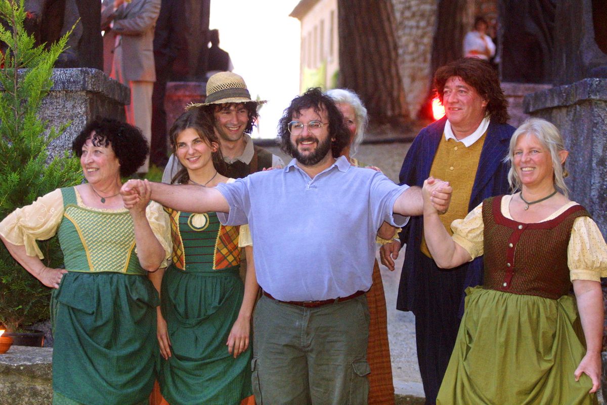 New-Zealand’s director/writer/producer Peter Jackson (C) poses at the hill-top Chateau Castellaras with actors for the party of the film “The Lord of the Rings”, during the 54th Cannes Film Festival, 13 May 2001. “The Lord of the Rings” is not screening at the Cannes Film Festival, it’s not even finished, but the “Lord of the Rings” trilogy, being filmed by New Line cinema, looks so much like being a mega hit that the studio is going all-out to build the hype. 