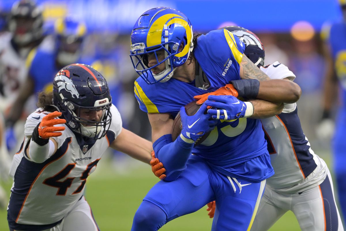 Tight end Tyler Higbee #89 of the Los Angeles Rams runs the ball after a complete pass against the Denver Broncos at SoFi Stadium on December 25, 2022 in Inglewood, California.