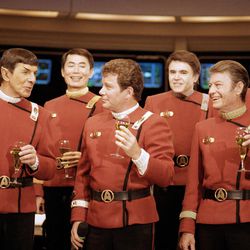 Members of the "Star Trek" crew, from right in front: DeForest Kelley, William Shanter and Leonard Nimoy, and back row from right: James Doohan, Walter Koenig, George Takei and Nichelle Nichols, toast the newest "Trek" film--in which Shanter makes his directorial debut--"Star Trek V: The Final Frontier," during a news conference Dec. 28, 1988 at Paramount Studios to announce the latest voyage.