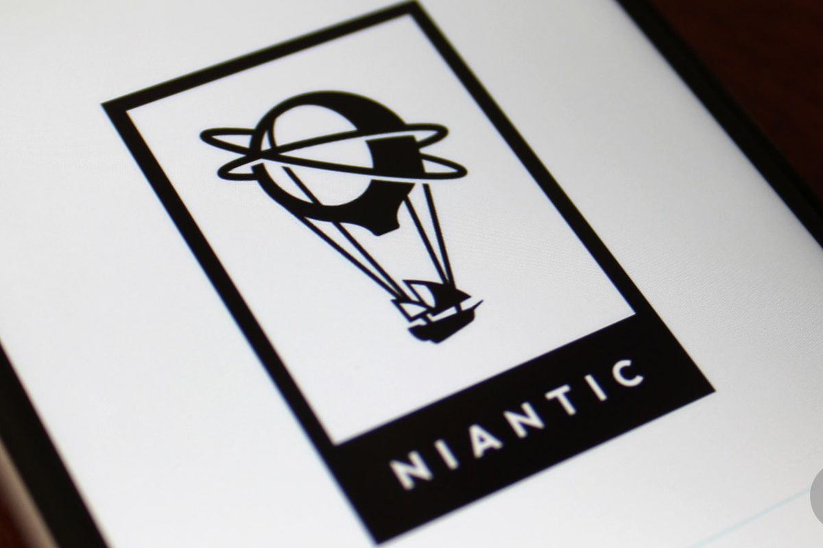 A photo of a phone displaying the Niantic logo