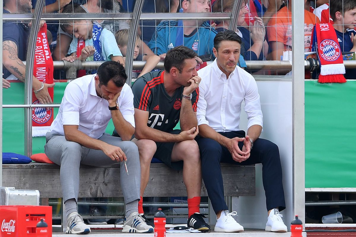DROCHTERSEN, GERMANY - AUGUST 18: Hasan Salihamidzic, sports director and Nico Kovac, head coach of Muenchen ponders during the DFB Cup first round match between SV Drochtersen-Assel and Bayern Muenchen on August 18, 2018 in Drochtersen, Germany. 
