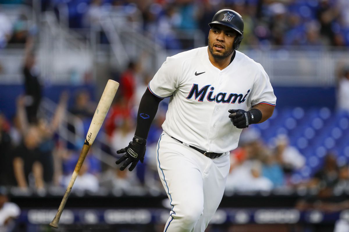 Miami Marlins first baseman Jesus Aguilar (99) flips his bat after hitting a home run during the third inning against the Milwaukee Brewers at loanDepot Park.