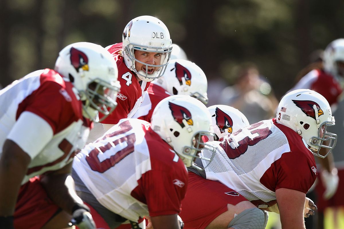 FLAGSTAFF, AZ - AUGUST 04:  Quarterback Kevin Kolb #4 of the Arizona Cardinals prepares to snap the ball during the team training camp at Northern Arizona University on August 4, 2011 in Flagstaff, Arizona.  (Photo by Christian Petersen/Getty Images)