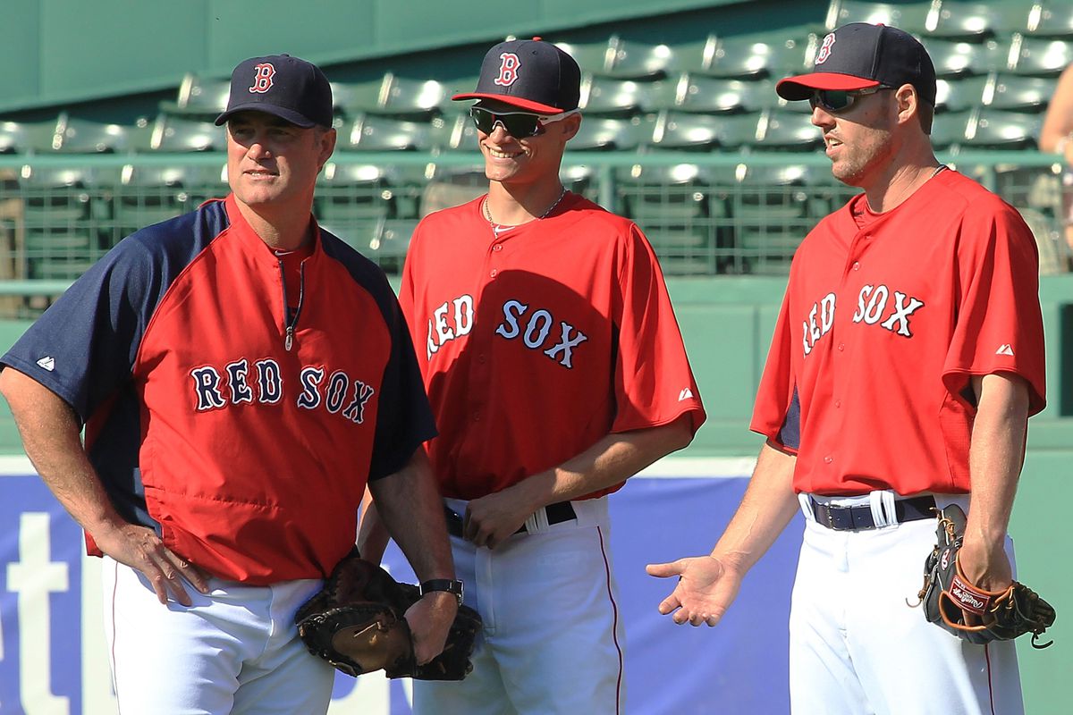 Ball, center, spending time at Fenway with Johns Farrell and Lackey.