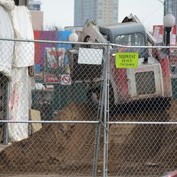 Dirt being brought out through the main gate, and being piled up in front of the ballpark -
