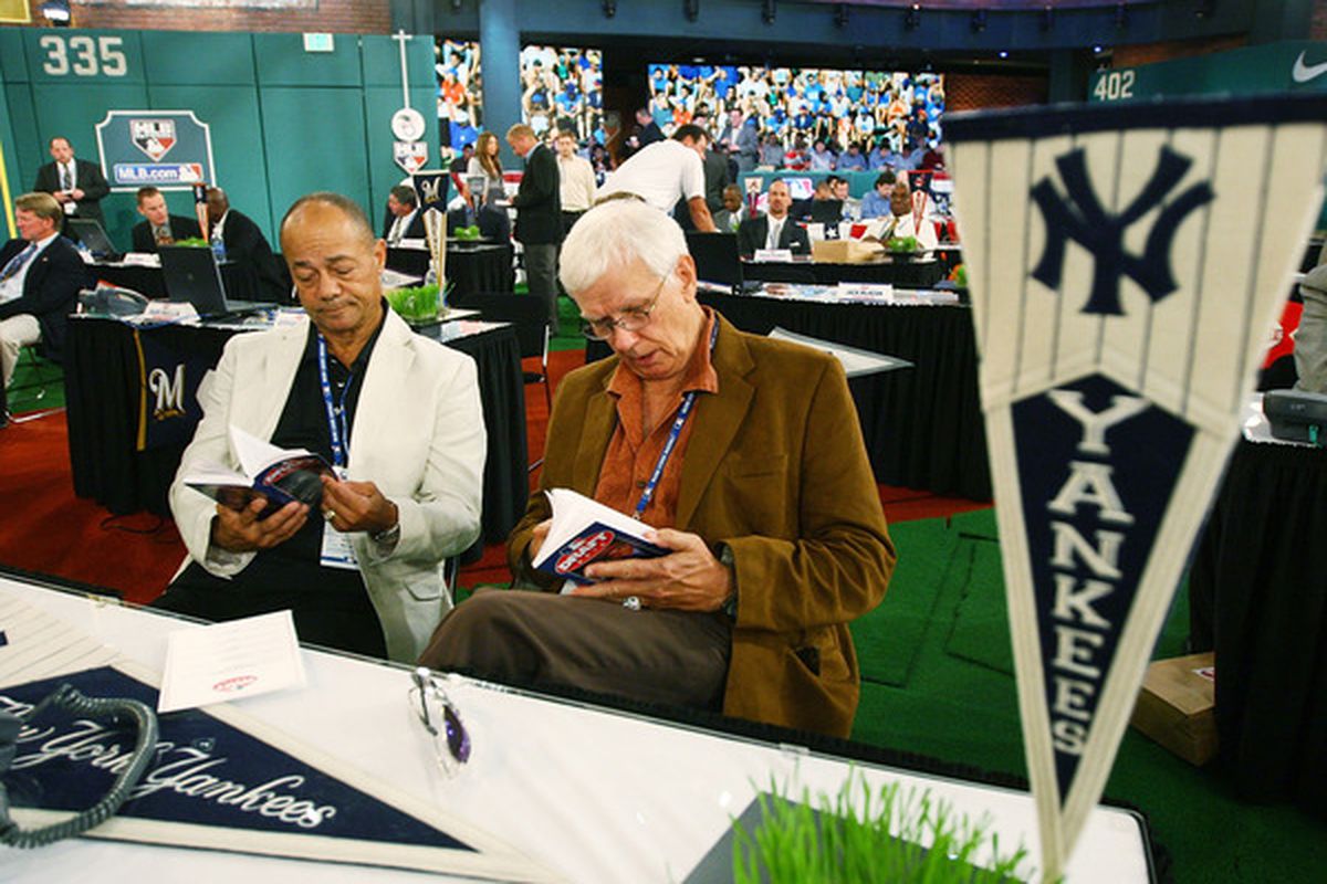 Yankees 2010 draft table, featuring team representatives Roy White and Gene Michaels.