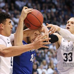 Brigham Young Cougars center Corbin Kaufusi (44) and teammate Brigham Young Cougars forward Nate Austin (33) defend Creighton Bluejays forward Zach Hanson (40) as BYU and Creighton play in NIT quarterfinal action at the Marriott Center in Provo Tuesday, March 22, 2016.