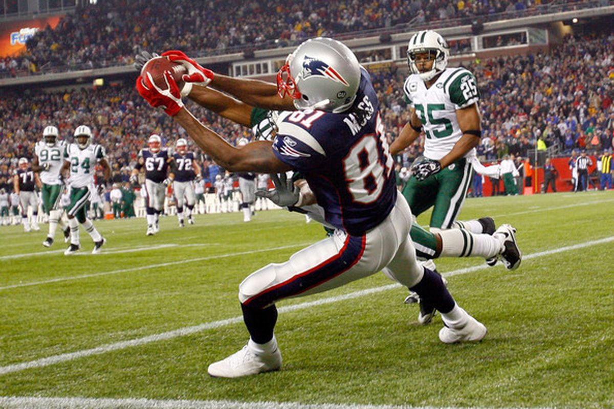 <em>Randy Moss catches a touchdown pass against the Jets' Ty Law and Kerry Rhodes, sending the game to overtime at Gillette Stadium on November 13, 2008.</em>