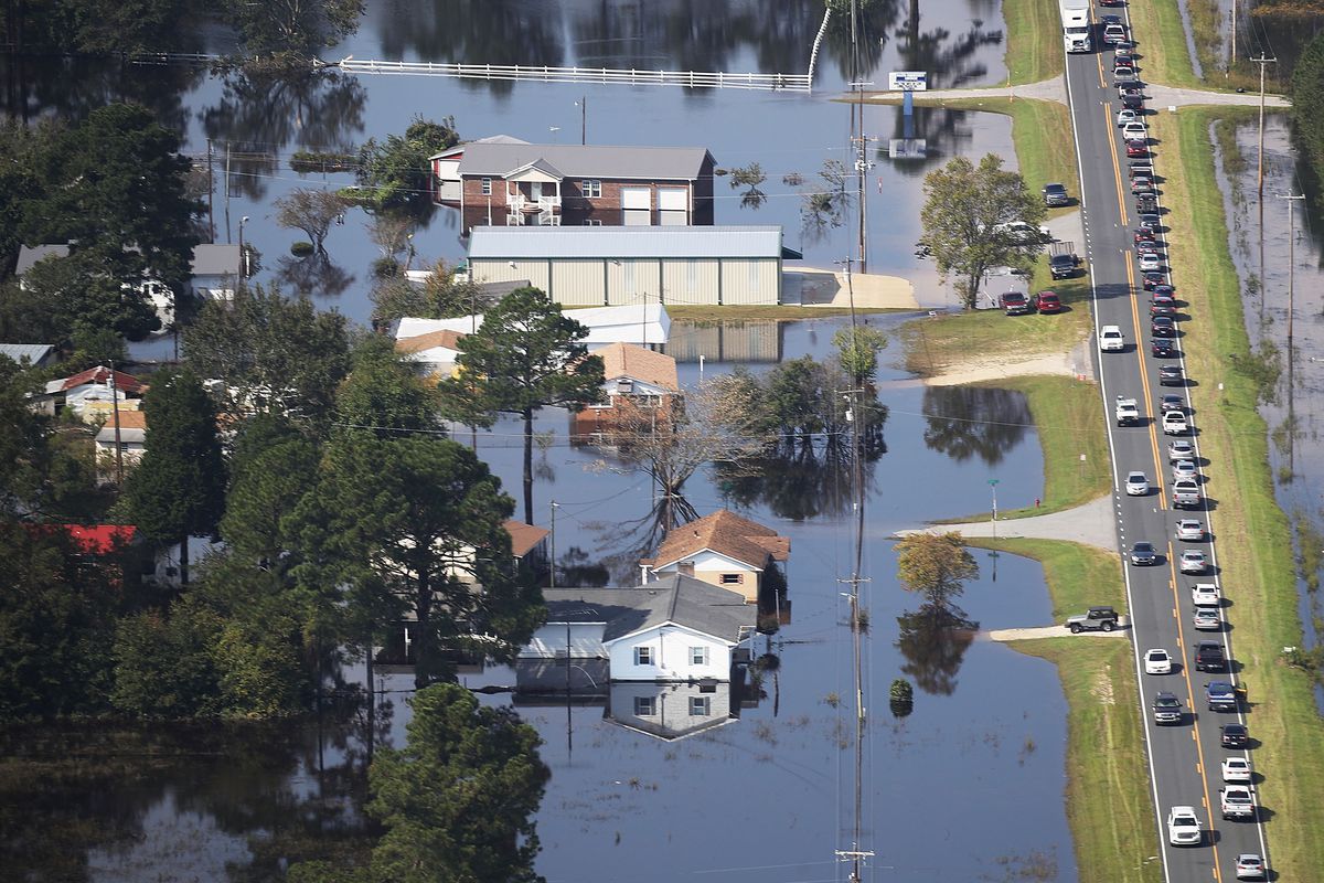 Flood waters are seen surrounding homes after heavy rains from Hurricane Florence on September 20, 2018 in Lumberton, North Carolina. The rainfall from Hurricane Florence was a 1,000-year event.