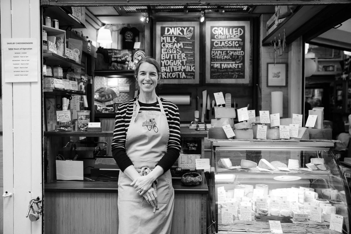 Anne Saxelby stands in front of Saxelby Cheesemongers, her New York City cheese shop.