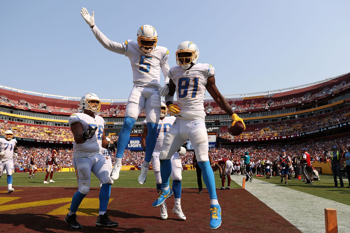 Mike Williams #81 of the Los Angeles Chargers celebrates with teammates after catching a three yard touchdown reception during the fourth quarter against the Washington Football Team at FedExField on September 12, 2021 in Landover, Maryland.