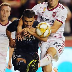 Real Salt Lake defender Aaron Herrera (22) battles for the ball with Los Angeles Galaxy midfielder Servando Carrasco (6) as Real Salt Lake and the LA Galaxy play at Rio Tinto Stadium in Sandy on Wednesday, Sept. 25, 2019. LA won 2-1.