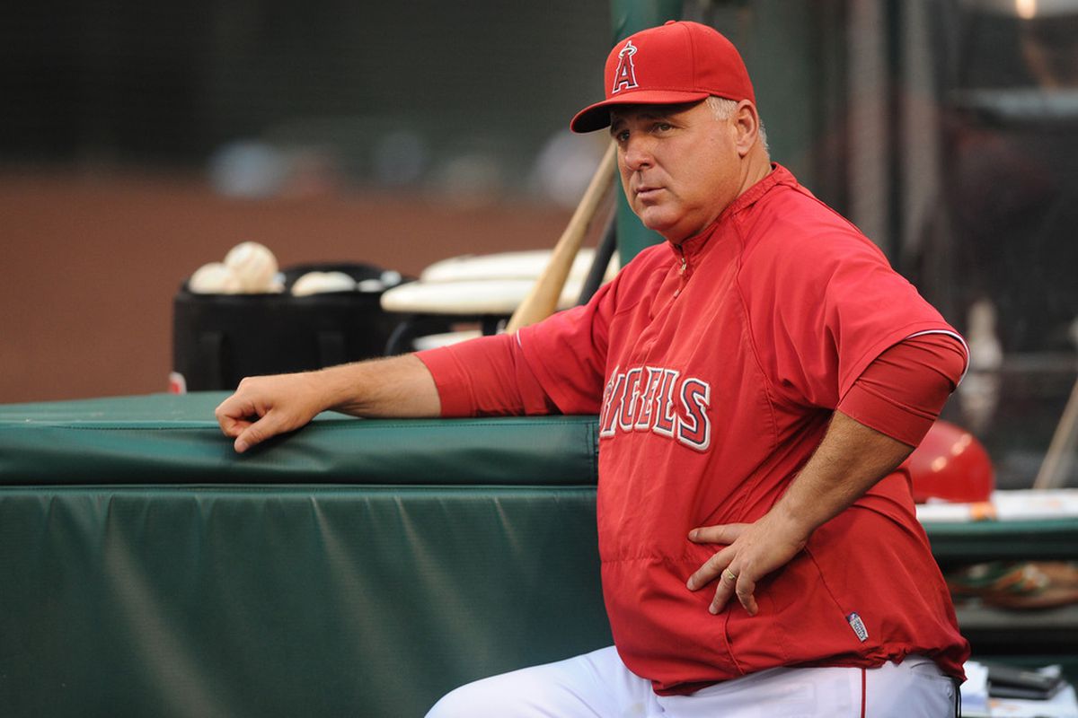 Jun 15, 2012; Anaheim, CA, USA; Los Angeles Angels manager Mike Scioscia waits in the dug out prior to the game between the Los Angeles Angels and Arizona Diamondbacks at Angel Stadium of Anaheim.