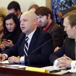 Jeremy Cunningham, center, speaks during a committee meeting concerning SB51 at the Capitol in Salt Lake City, Friday, Feb. 3, 2012. At right is Sen. Ben McAdams, D-Salt Lake, sponsor of the bill.