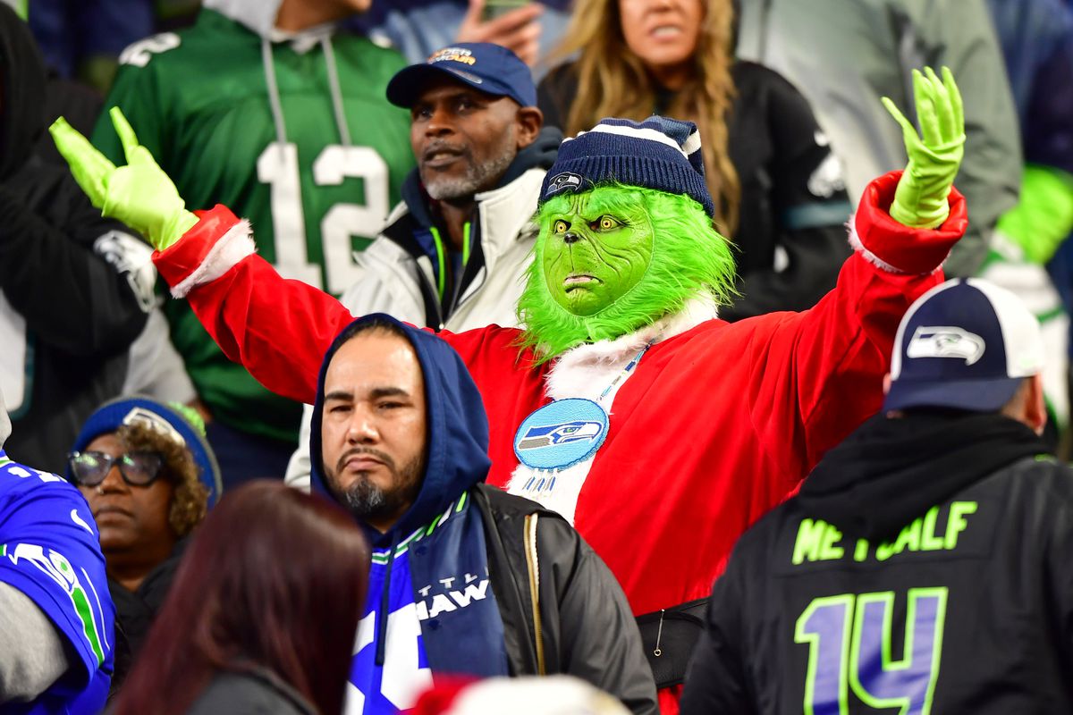 A Seattle Seahawks fan dressed as The Grinch is seen at Lumen Field on December 18, 2023 in Seattle, Washington.