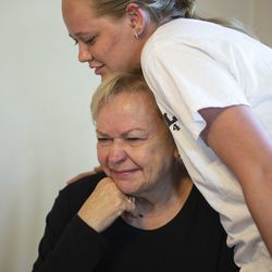 Celestia Cragun is comforted by her granddaughter Caitlin Shreeve in her home in Cottonwood Heights, Utah, on Saturday, June 8, 2019. Cragun's husband passed away in February of this year and she has been taking care of her 40-year-old son, Robbie, by herself ever since.