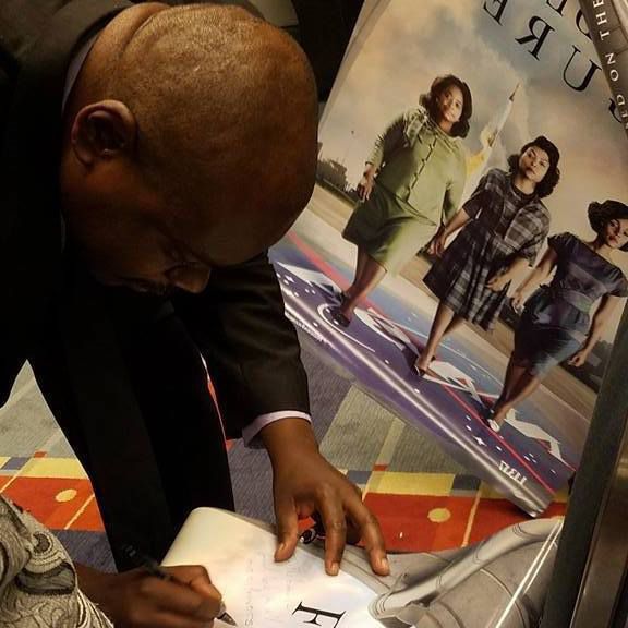 Mathematician Rudy Horne signing autographs at a Congressional Black Caucus Event. | Photo by Kimberly F. Sellers/ Georgetown University