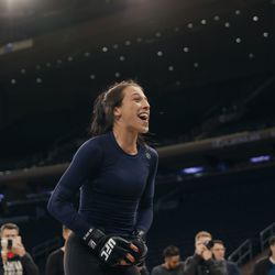 Joanna Jedrzejczyk has a laugh with the crowd at UFC 217 workouts.
